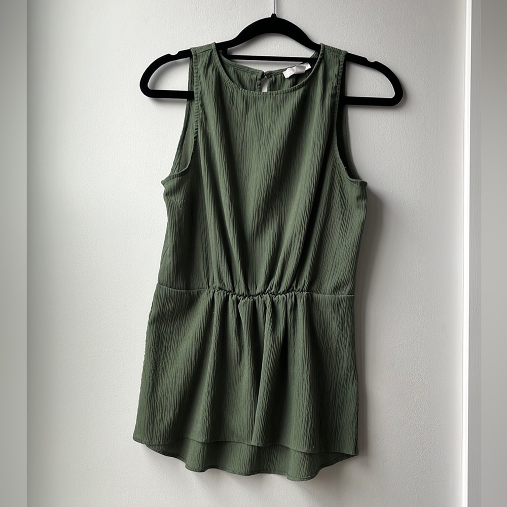 Green sleeveless blouse
